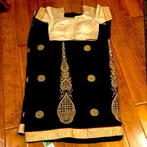 Black sari with gold border and blouse